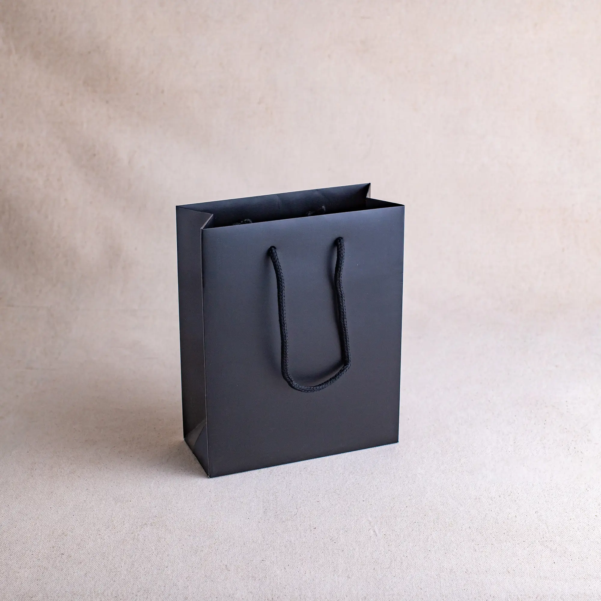 Show details for FSC® Black Luxury Laminated Rope Handle Paper Bags - Plain