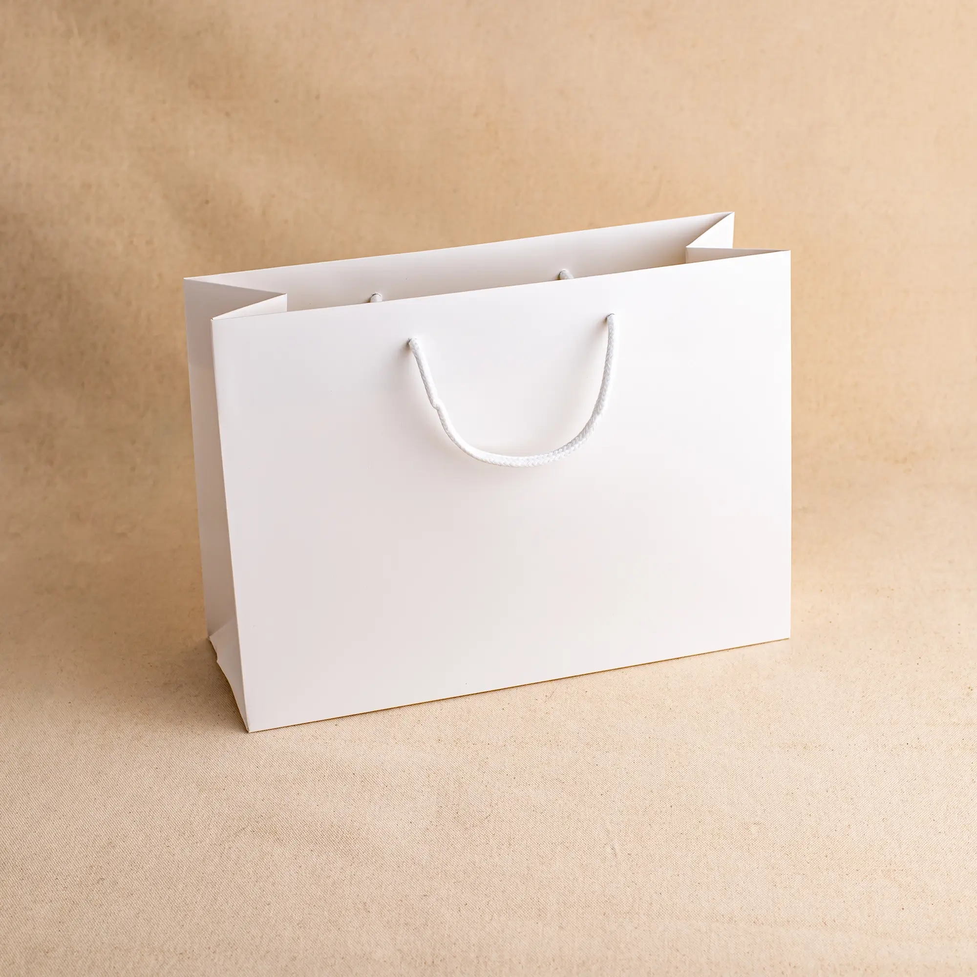 Show details for FSC® White Luxury Laminated Rope Handle Paper Bags - Plain
